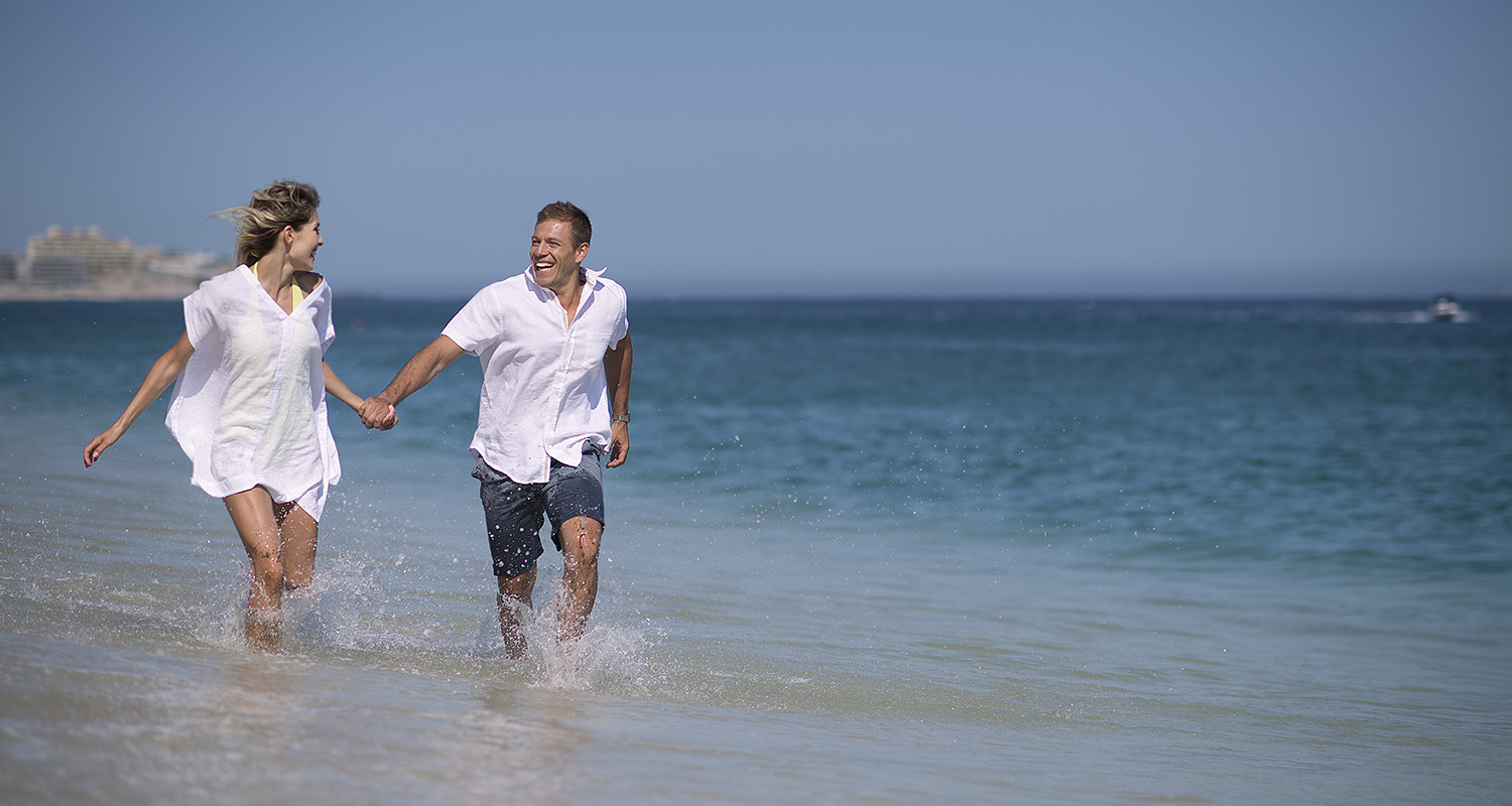 Couple enjoying vacation on Cabo beach